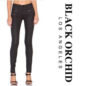 Black jeans with zippers and rips